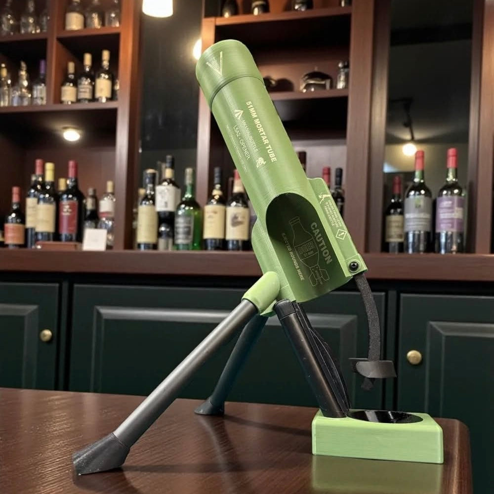 Military-inspired bottle cap mortar opener displayed on a bar counter